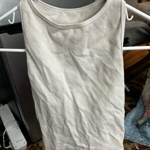 Cream sleeveless tank top with crew neck